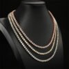 Side view of white and rose gold 4mm tennis chains on display mannequin