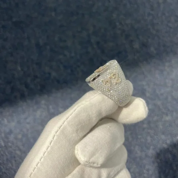 Side view of Hip Hop Champion Ring in sterling silver with moissanite, 14K white gold plated, iced out design showing raised 72 and intricate side details