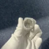 Close up of Hip Hop Champion Ring in sterling silver with moissanite,   14K white gold plated,   iced out ring held in hand showing Bottom view