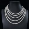 Five 6.5mm 925 silver moissanite tennis chains hanging on mannequin display