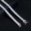 Close-up of two white gold halo bracelets with visible end clasps and VVS stones