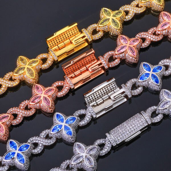 Four finishes of Lucky Clover Cuban Link laid on black background with clasps open showing detail.