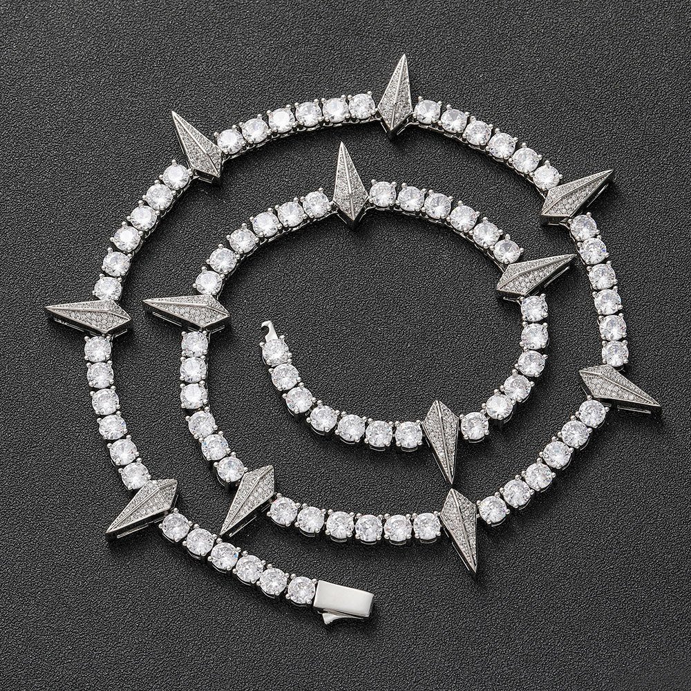 Silver panther tennis chain coiled on a black background showing iced out shine