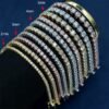 Silver moissanite tennis chains in 2mm to 6.5mm sizes displayed on a balck cylinder