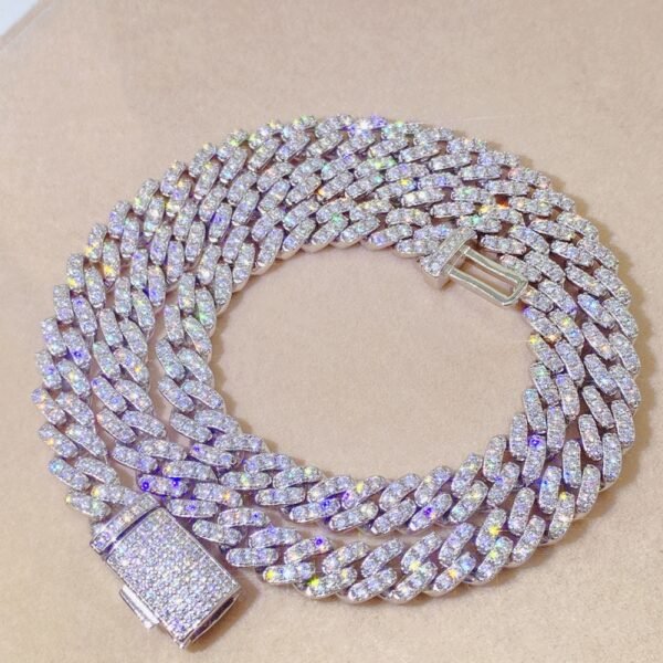 8mm silver Round Cuban chain with GRA certified VVS moissanite laid flat showing polished round links and craftsmanship