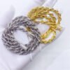 Detail shot of gold and silver 6mm rope chain showing texture and shine