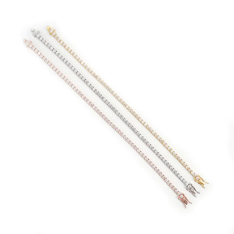 2mm moissanite tennis chain in white gold, yellow gold, and rose gold laid flat, 925 silver base