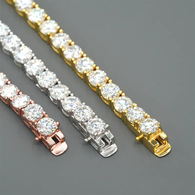 Flat-laid 5mm tennis chains in three colors showing one clasp