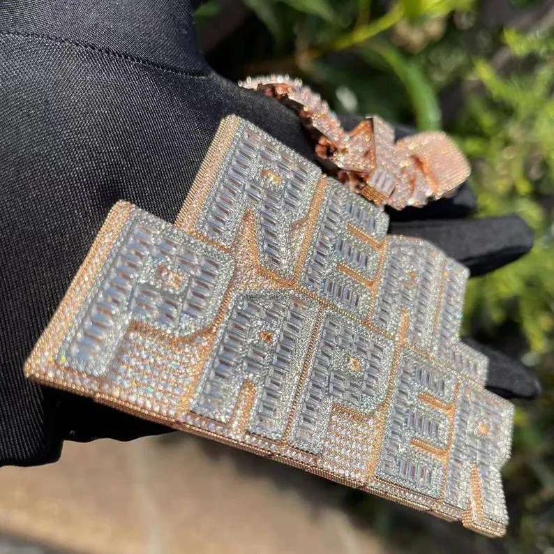 Statement-sized silver letter pendant nameplate with GRA certified VVS moissanite, hanging naturally on iced out chain.