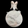 Front view of custom round disc pendant with semi-relief eagle design and goat head bail,   in 925 silver with VVS moissanite,   on black background.