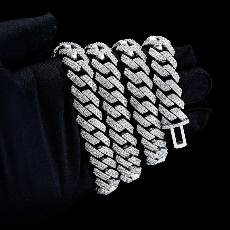 Close up of Custom Clasp 16MM Moissanite Cuban Link Chain in sterling silver with rose gold plating, FATBOY custom clasp detail wrapped around hand