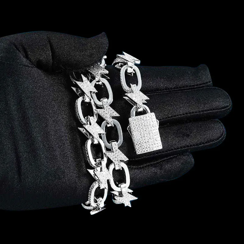 Close up of 14mm Bolt Link Chain necklace in sterling silver with VVS moissanite, 14K white gold plated, box clasp detail wrapped around hand