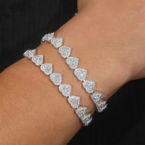 man wearing 8mm moissanite heart bracelet in 14K gold