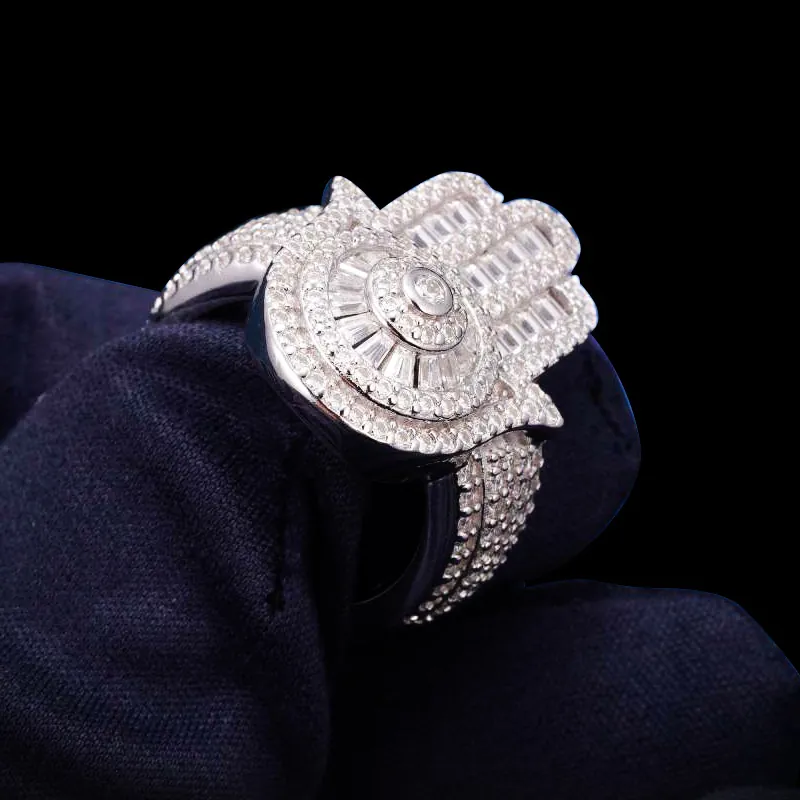 Close up of Hand Shaped Ring in sterling silver with moissanite, 14K white gold plated, iced out design shown from angled side view