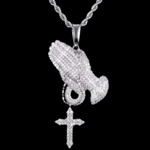 VVS Praying Hands Pendant in brass with CZ stones, 14K white gold plated, hanging on 3mm rope chain on black background, iced out hip hop jewelry