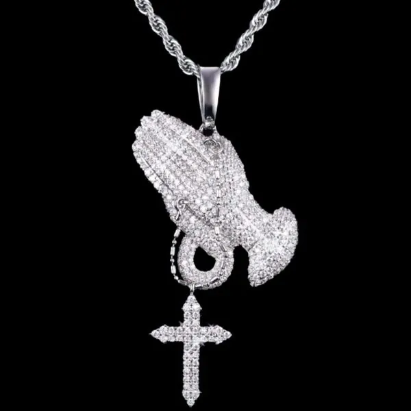 VVS Praying Hands Pendant in brass with CZ stones, 14K white gold plated, hanging on 3mm rope chain on black background, iced out hip hop jewelry