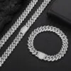 Silver 10mm Miami Cuban chain necklace and bracelet set displayed on table
