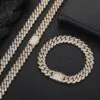 Gold 10mm Miami Cuban chain necklace and bracelet set displayed on table
