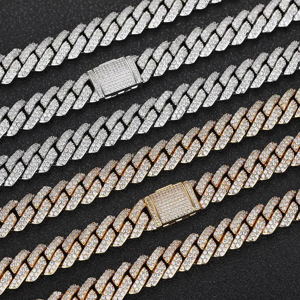 Six iced out 10mm Miami Cuban chains in silver and gold laid on black background