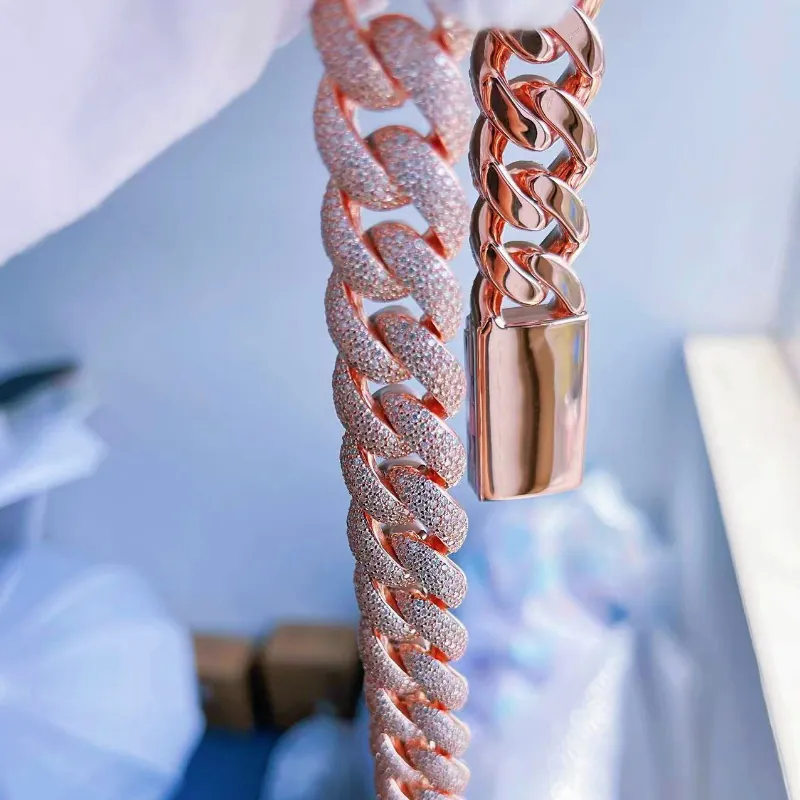 17mm custom smooth Cuban chain in silver with VVS moissanite, shown hanging by hand to display both front and back details