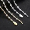 Two Special Links Tennis Chains laid flat on black background, gold facing up, silver showing back side for detail view