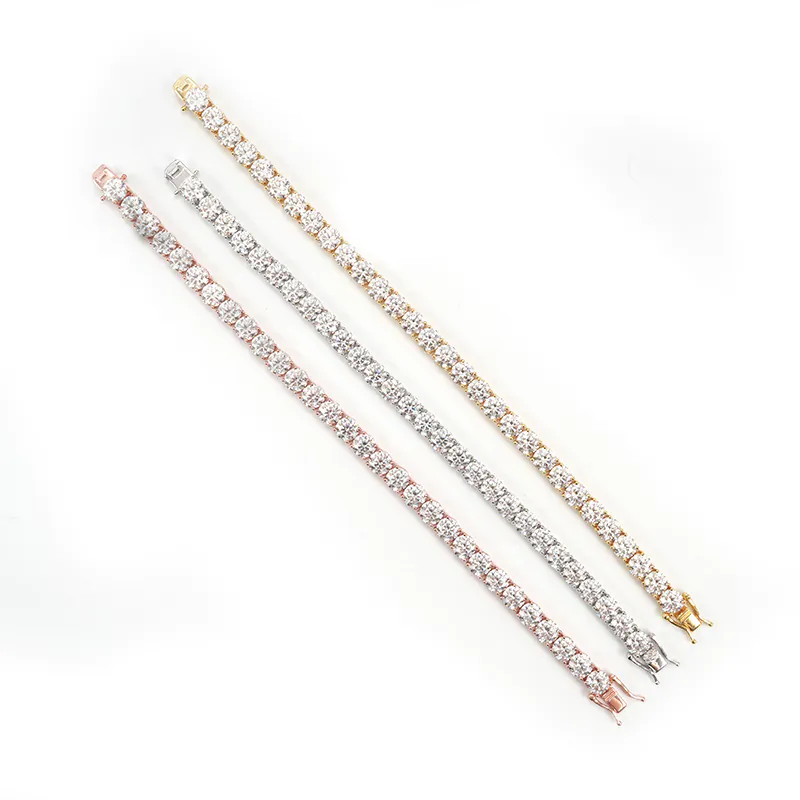 Flat lay of 6.5mm moissanite tennis chains in three colors on white background for full length display