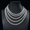Five 6.5mm 925 silver moissanite tennis chains hanging on mannequin display