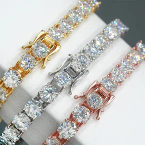 Close-up of 6.5mm moissanite tennis chains in white gold, yellow gold, and rose gold showing clasp and fire of stones