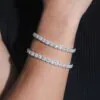 Two 6mm halo moissanite bracelets worn on wrist,   brilliant shine under light