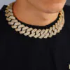 Man wearing a gold 26mm oversized Cuban chain,   demonstrating bold hip hop style and statement fashion