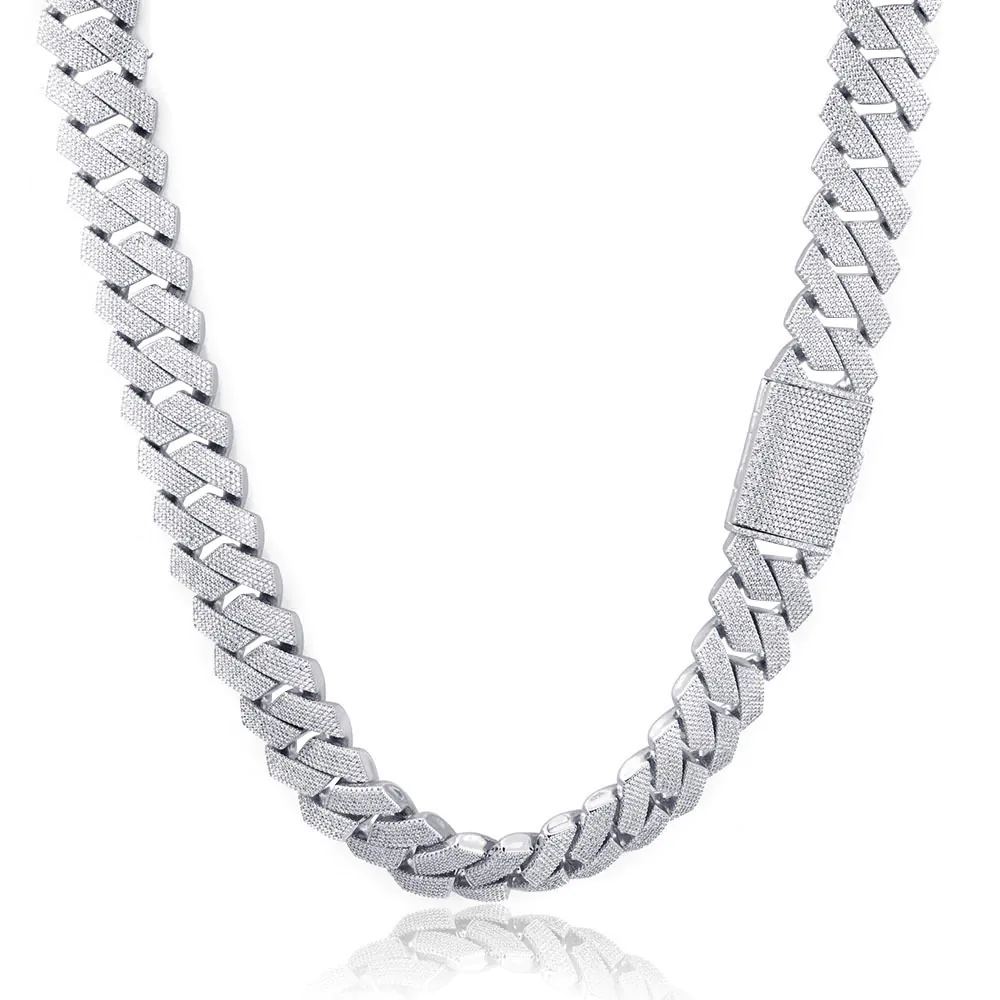 26mm gold iced Cuban chain coiled neatly on a white background, highlighting shine and link texture.