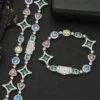 Silver colored tennis chain and bracelet set laid flat on a table with clasp closed