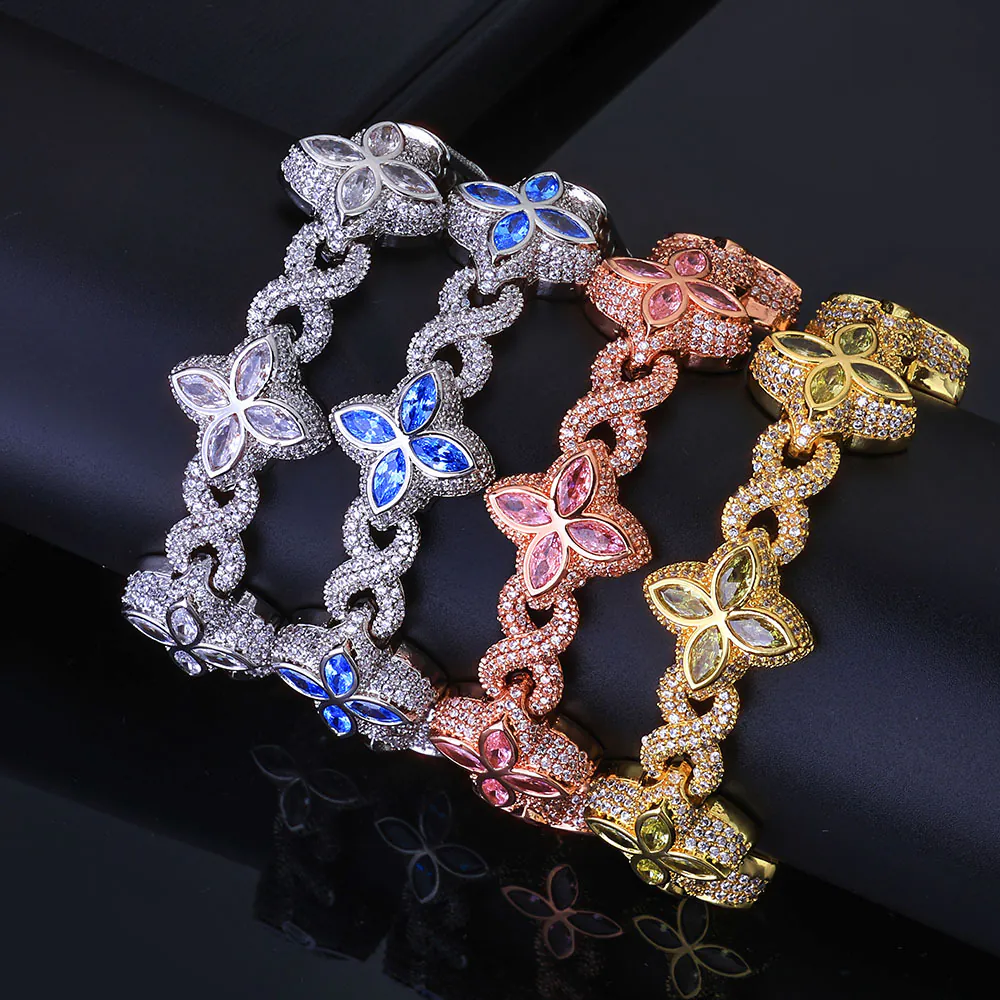 Four Colorful Lucky Clover Iced Cuban Link chains in different colors draped over a cylinder for wrist display.
