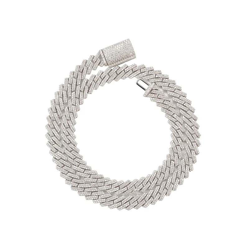 Silver 10mm moissanite Cuban link chain coiled in a circle on white background