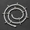 Silver panther tennis chain coiled on a black background showing iced out shine