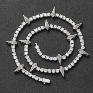 Silver panther tennis chain coiled on a black background showing iced out shine