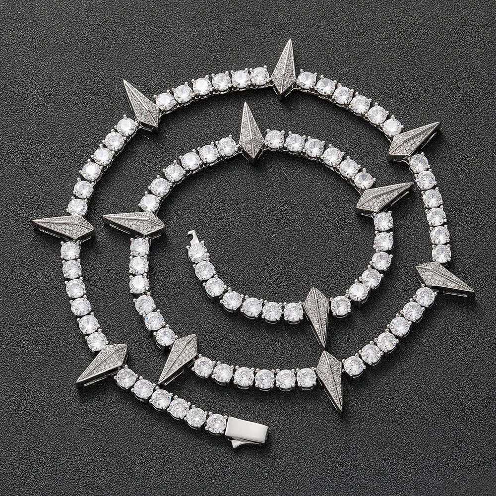 Silver panther tennis chain coiled on a black background showing iced out shine