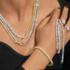 Woman wearing multiple VVS moissanite tennis chains,   bracelets,   and rings in 925 silver,   showcasing brilliant shine