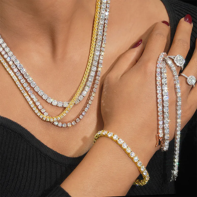 Woman wearing multiple VVS moissanite tennis chains, bracelets, and rings in 925 silver, showcasing brilliant shine