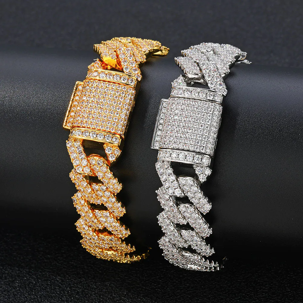One gold and one silver 14mm brass Cuban bracelet wrapped around a cylinder for wear simulation