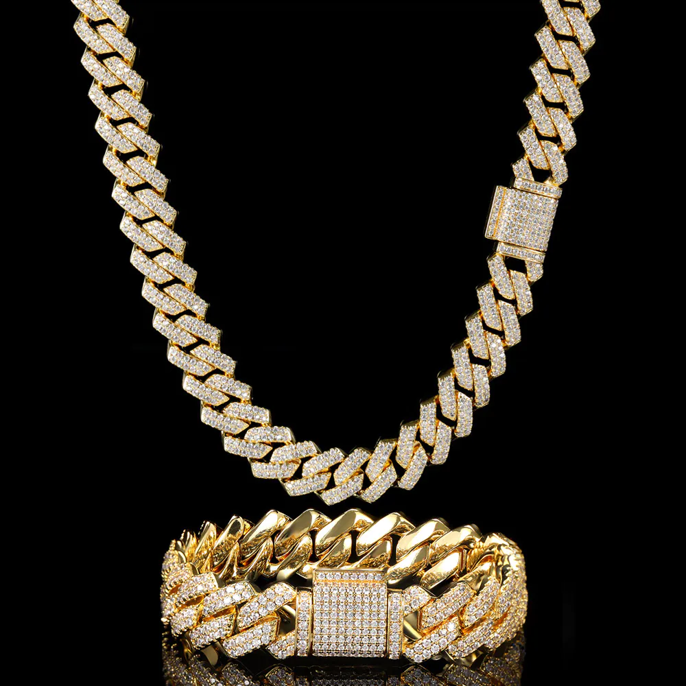 One gold 14mm Cuban chain hanging on top, with matching bracelet below on black background