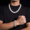 Model wearing 16mm Flat Cuban chain necklace and bracelet in silver VVS moissanite