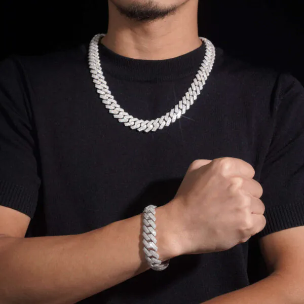 Model wearing 16mm Flat Cuban chain necklace and bracelet in silver VVS moissanite