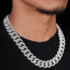 Model wearing 16mm Round Cuban chain necklace showing natural drape,   moissanite brilliance,   and iced out luxury look