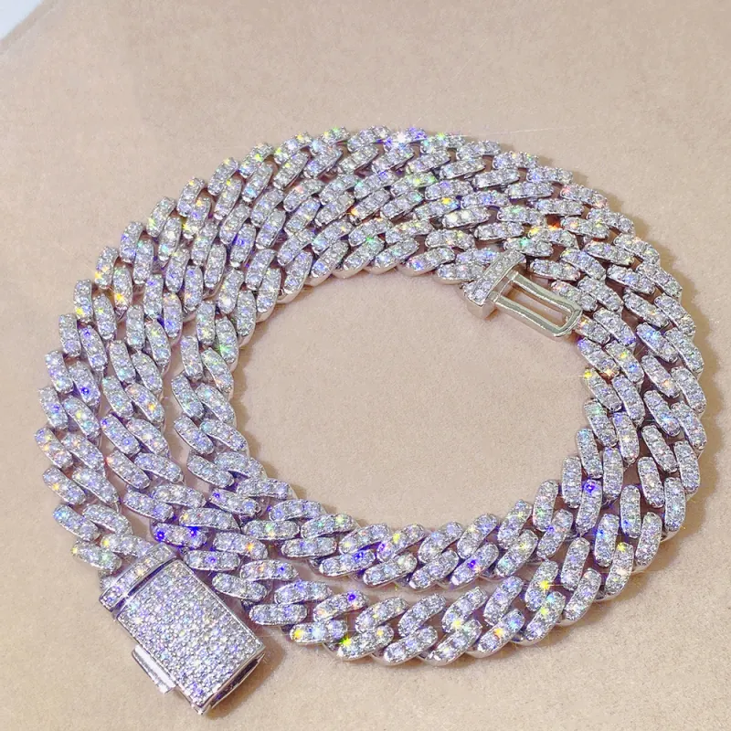 8mm silver Round Cuban chain with GRA certified VVS moissanite laid flat showing polished round links and craftsmanship