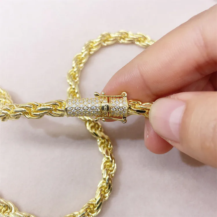 Close-up of gold iced moissanite lock on 6mm rope chain