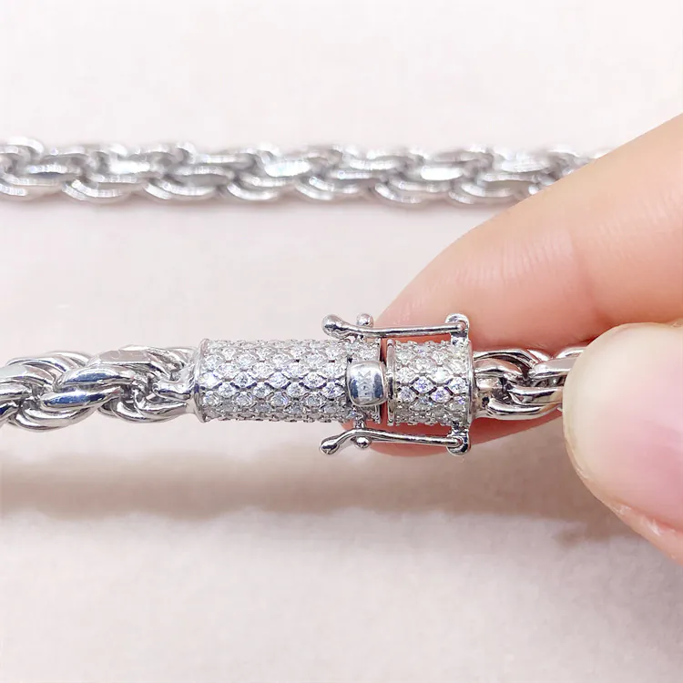 Close-up of white gold iced moissanite lock on 6mm rope chain