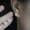 model wearing 10mm moissanite baguette cluster square stud earrings in 925 silver