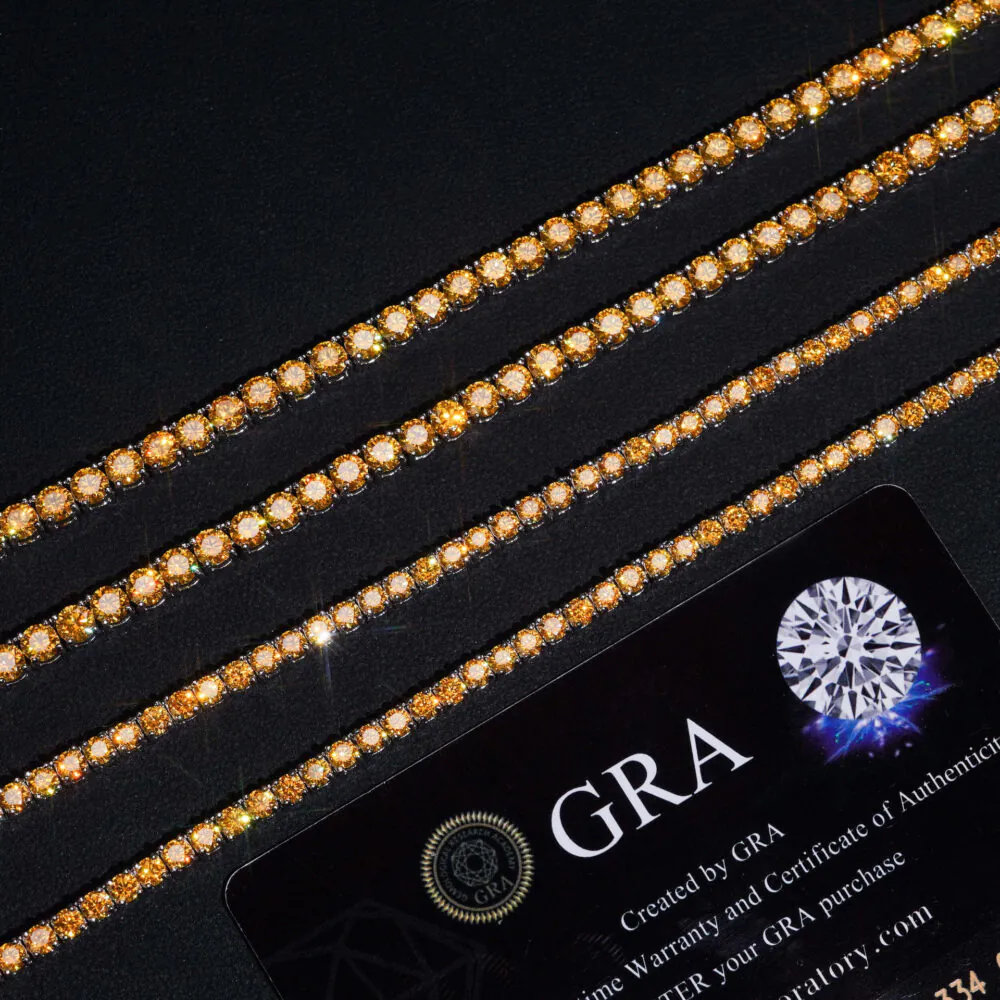 Close-up of yellow VVS moissanite stones on 14K white gold plated tennis chain