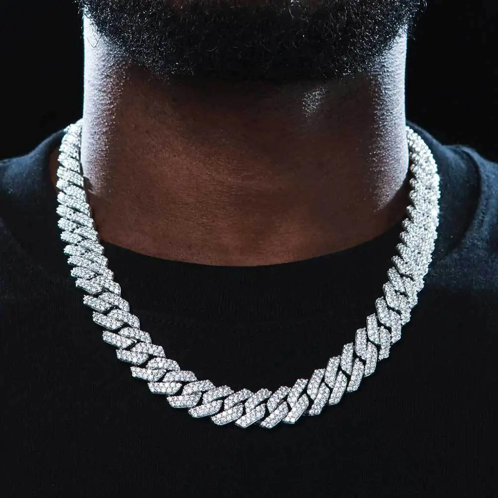Male model wearing a gold CZ Cuban Link chain, showcasing hip hop jewelry style and streetwear fashion.